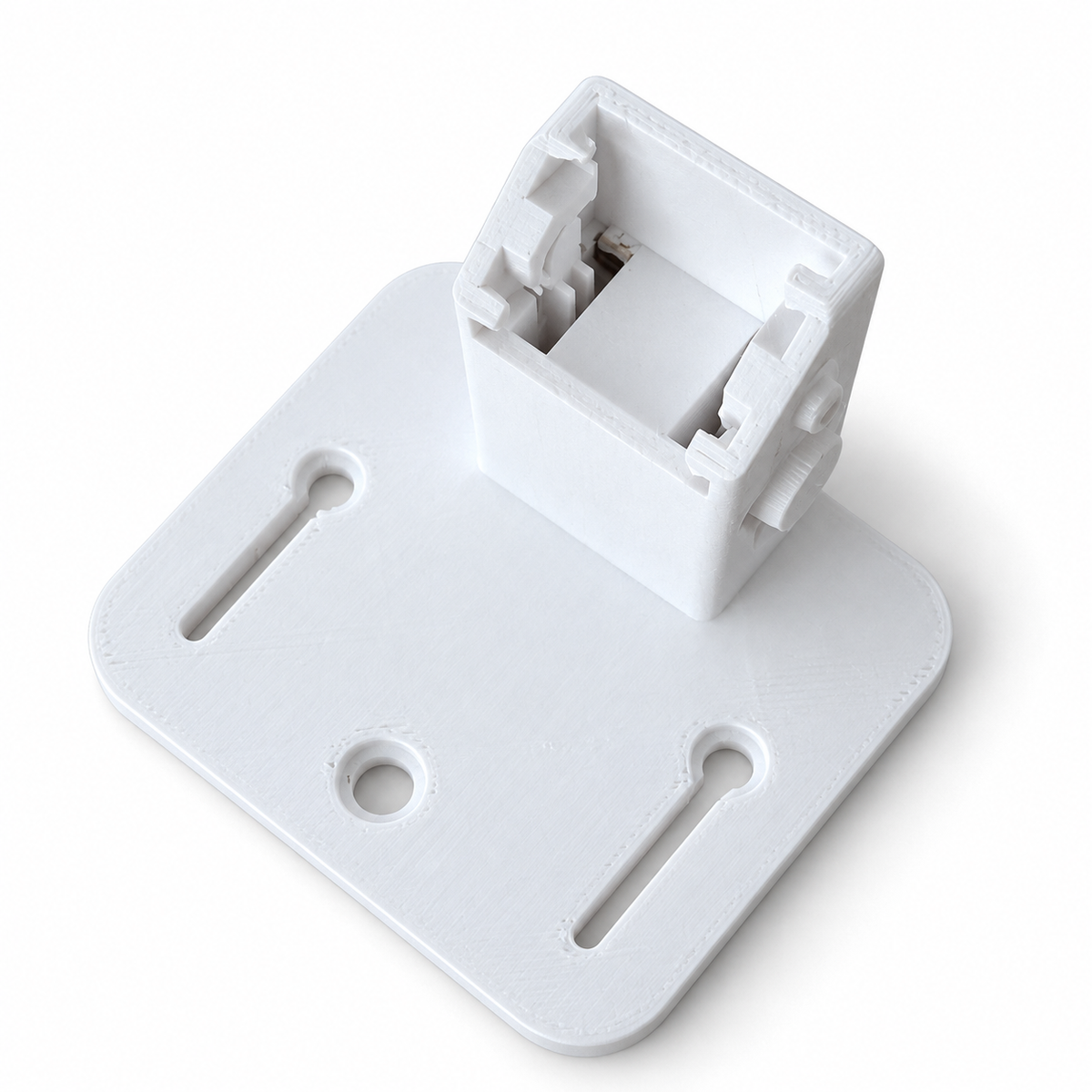 White 3D-printed PETG camera mount viewed from above, showing its camera engagement slots and mounting holes.